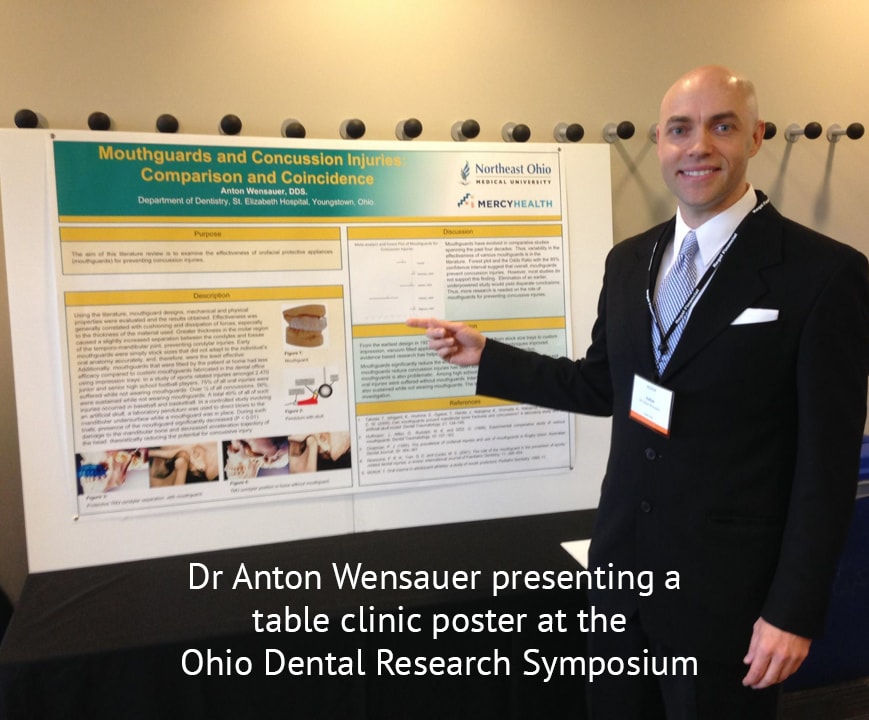 Dr Anton Wensauer presenting a table clinic poster at the Ohio Dental Research Symposium